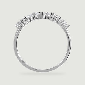 A side view of the white gold ring shows its open stone baskets and polished band.
