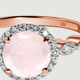 A 14K stamp is visible inside the polished rose gold band above the diamond halo.