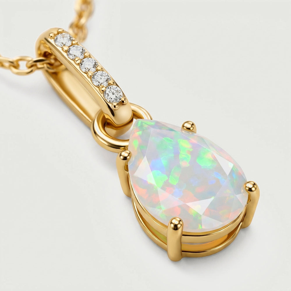 A close view shows the faceted opal, rounded gold prongs and five clear stones in the curved bail.