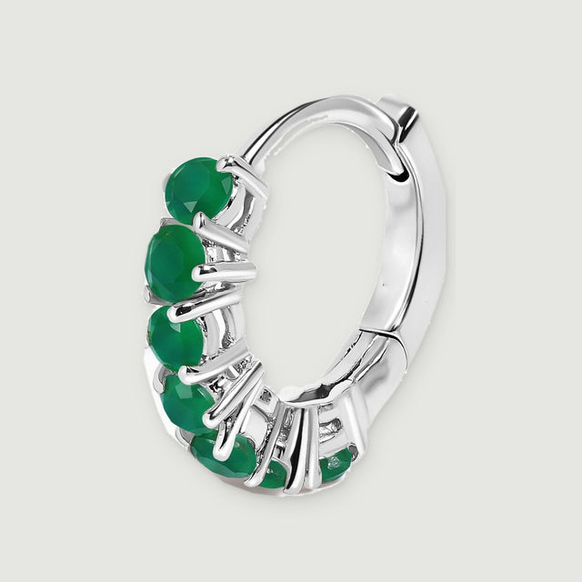 A single white rhodium plated hoop reveals its open center, green stone row, and hinged back.