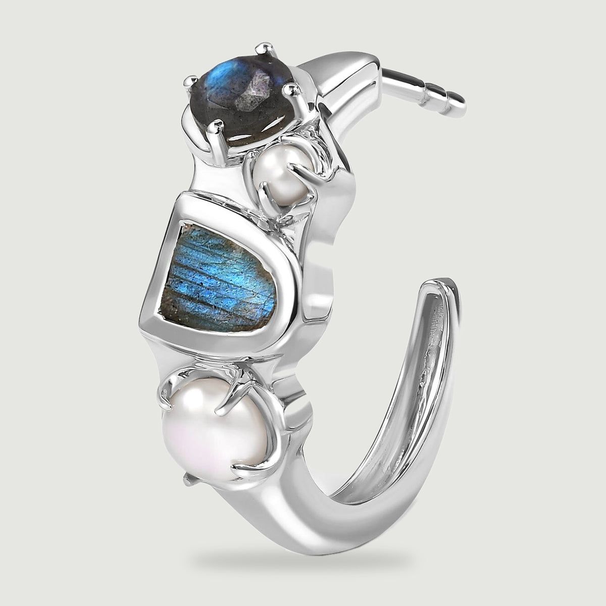 A single white rhodium plated hoop is shown at an angle with its straight post, curved back, blue labradorite stones and white pearls visible.