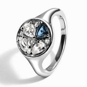 The silver ring stands at an angle with its inner band and 925 stamp visible.