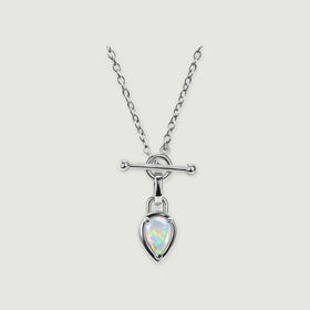 A bright silver-colored necklace with a pear-shaped opal suspended below a circular connector is centered on light gray.