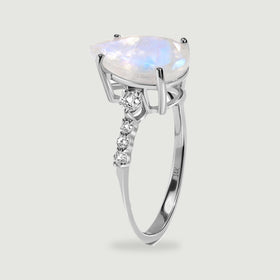 The white gold ring is shown upright with its open setting and graduated diamond shoulders visible.