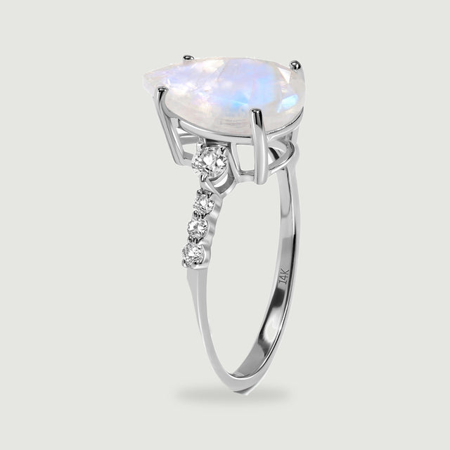 The white gold ring is shown upright with its open setting and graduated diamond shoulders visible.