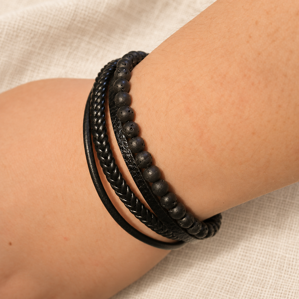 Dark Texture lava-bead bracelet worn on a wrist.