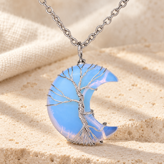 Translucent blue-white crescent pendant with silver-toned wire branches.