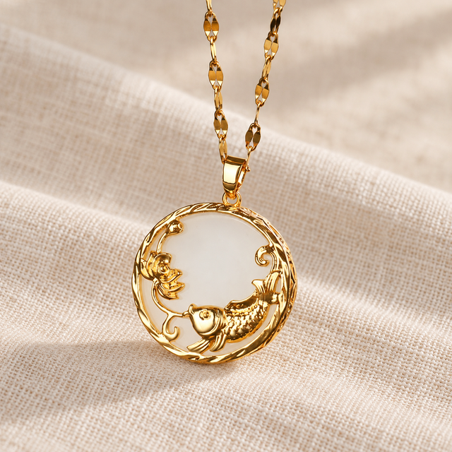 Ivory-white circular pendant with a gold-toned koi and lotus motif.