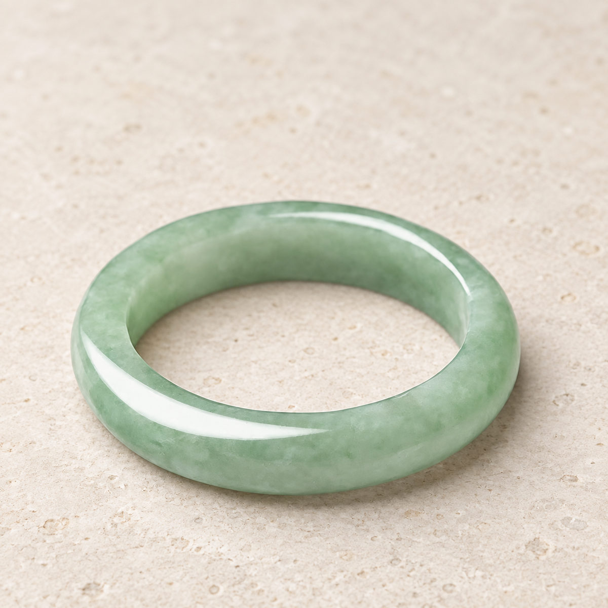 Jade band lying flat, showing its rounded profile