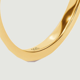 A close view of the curved yellow gold inner band shows the small 925 purity stamp.