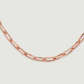 A close view shows rose gold tone links interlocking along the lower curve of the chain.