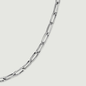 Polished silver tone links curve diagonally across a clean light grey surface.