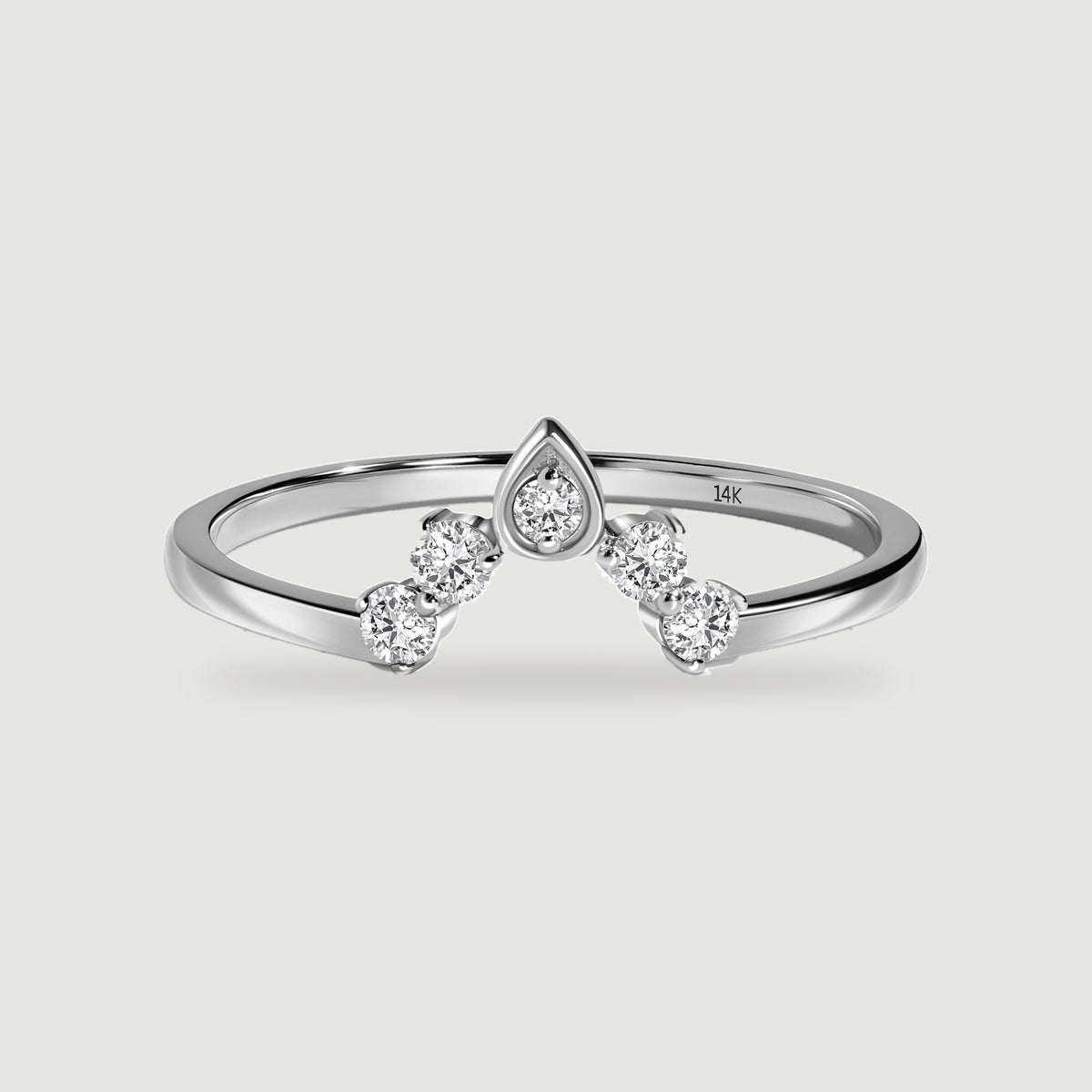 A polished white gold ring shows a pointed center setting and two round diamonds on each side.