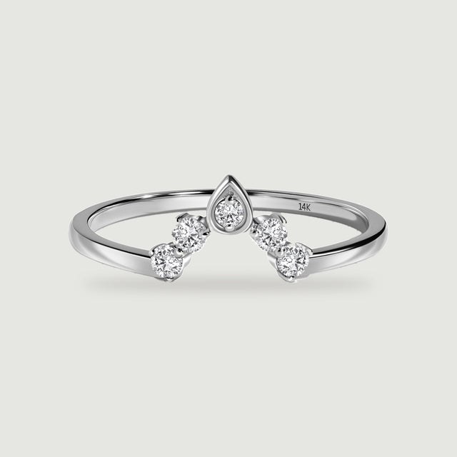 A polished white gold ring shows a pointed center setting and two round diamonds on each side.