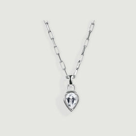 A silver-tone necklace with elongated links and a clear pear-shaped pendant is centered on a light gray surface.