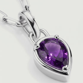 A faceted amethyst pendant has a bright silver-colored rim and three visible prongs.