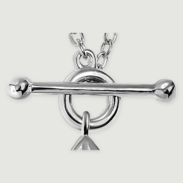 Polished silver ball ends and a horizontal toggle bar sit across a circular ring with oval chain links visible above.