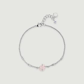 A silver tone chain curves around a raw pink quartz centerpiece with four clear accent stones and an adjustable clasp.