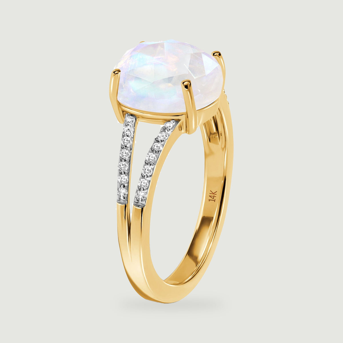 The side view shows the raised four-prong setting and polished yellow gold band.