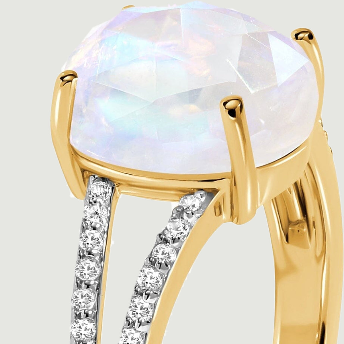 The elevated oval stone and diamond-lined split shoulder are visible from the side.