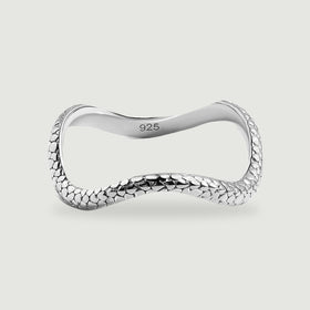 A complete polished silver ring has a curved band and raised oval texture on a light gray background.