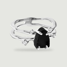 A sterling silver split band ring holds a black obsidian stone between four bright round accents.