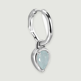 An angled silver-tone hoop reveals its hinged clasp, curved profile, and suspended aquamarine drop.
