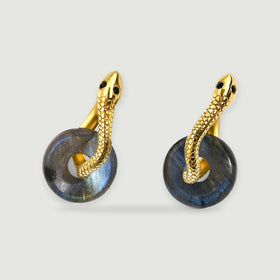 A pair of gold-tone earrings has blue-gray labradorite discs and textured curved hoops.