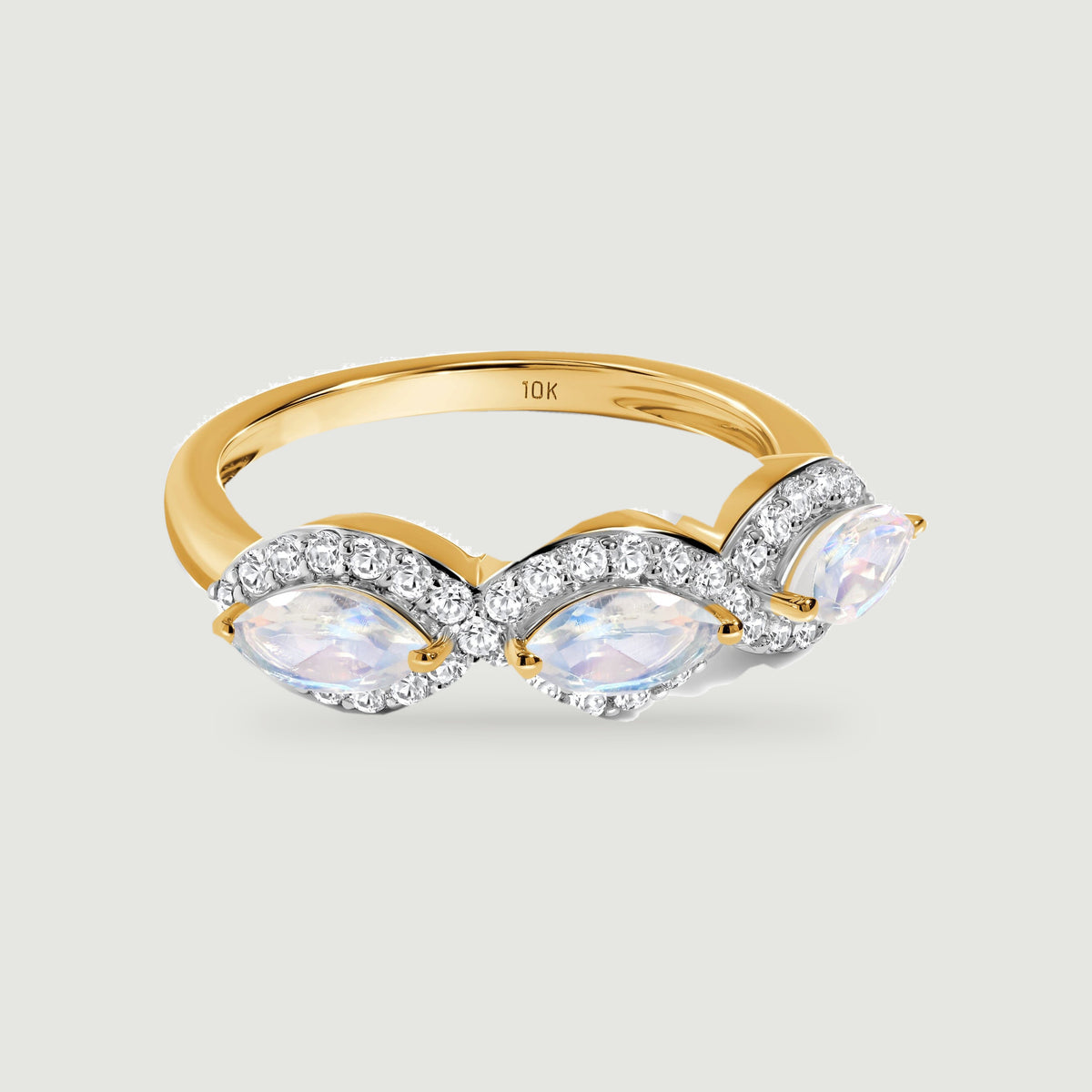 Three iridescent marquise stones sit across a polished yellow gold band with sparkling diamond borders.