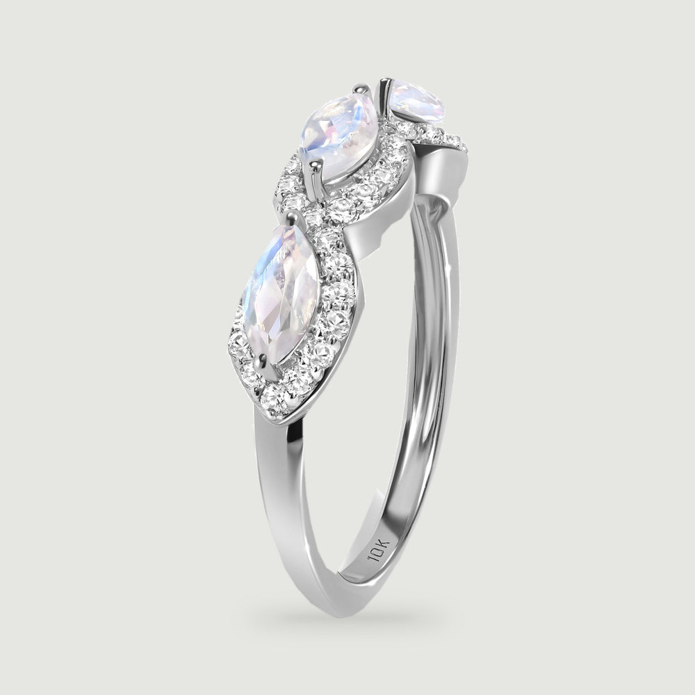 An upright white gold ring reveals the raised moonstone settings and smooth side of the band.