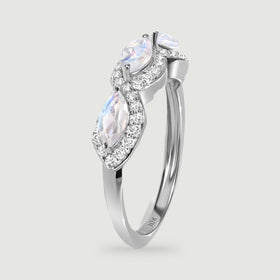 An upright white gold ring reveals the raised moonstone settings and smooth side of the band.
