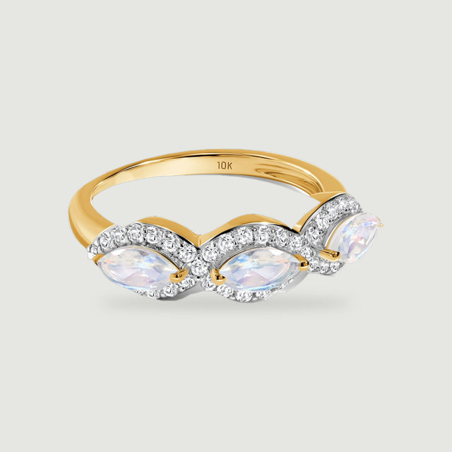 A yellow gold band supports three pale marquise moonstones framed by sparkling diamond curves.