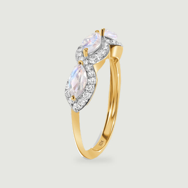 A yellow gold ring stands at an angle with raised gemstone settings and a 10K stamp inside the band.