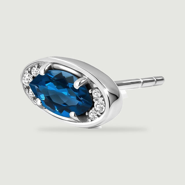 An angled silver-tone stud shows the curved setting wall and its slim straight post.