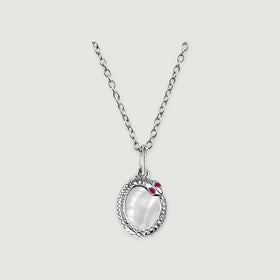 A white rhodium plated chain holds an oval mother of pearl pendant with a textured rim and two red accents.