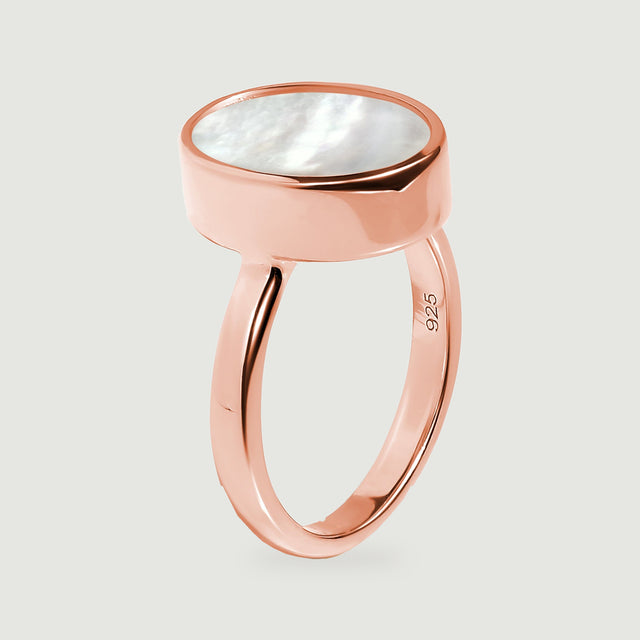 The side view reveals the raised oval setting and curved rose gold ring band.