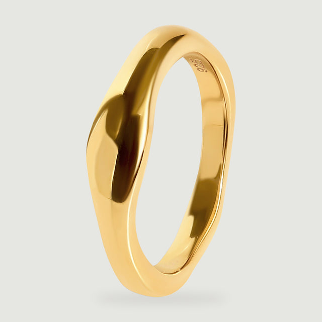 The yellow gold vermeil ring is shown upright at an angle with its rounded band and inner purity stamp visible.