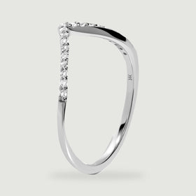 An upright white gold ring reveals its polished side, small stone settings, and inner 14K stamp.