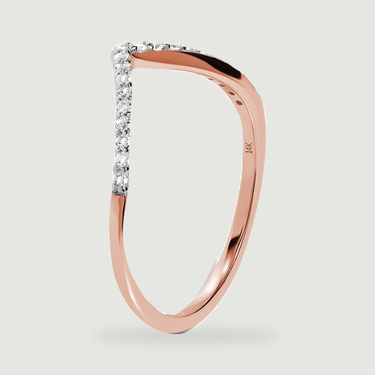 The rose gold ring is shown upright with open settings beneath the diamond-lined curve.