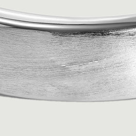 Fine horizontal brushing covers the silver band below its narrow polished rim.