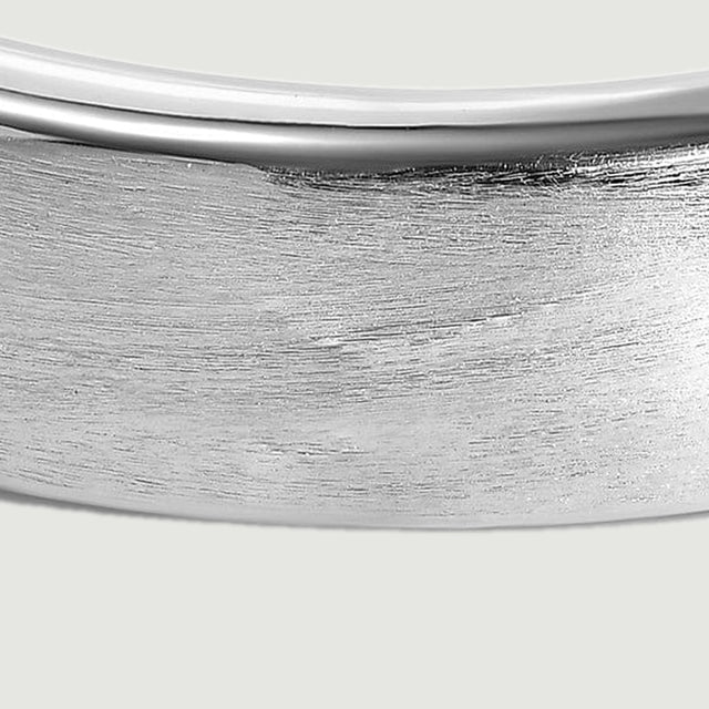 Fine horizontal brushing covers the silver band below its narrow polished rim.