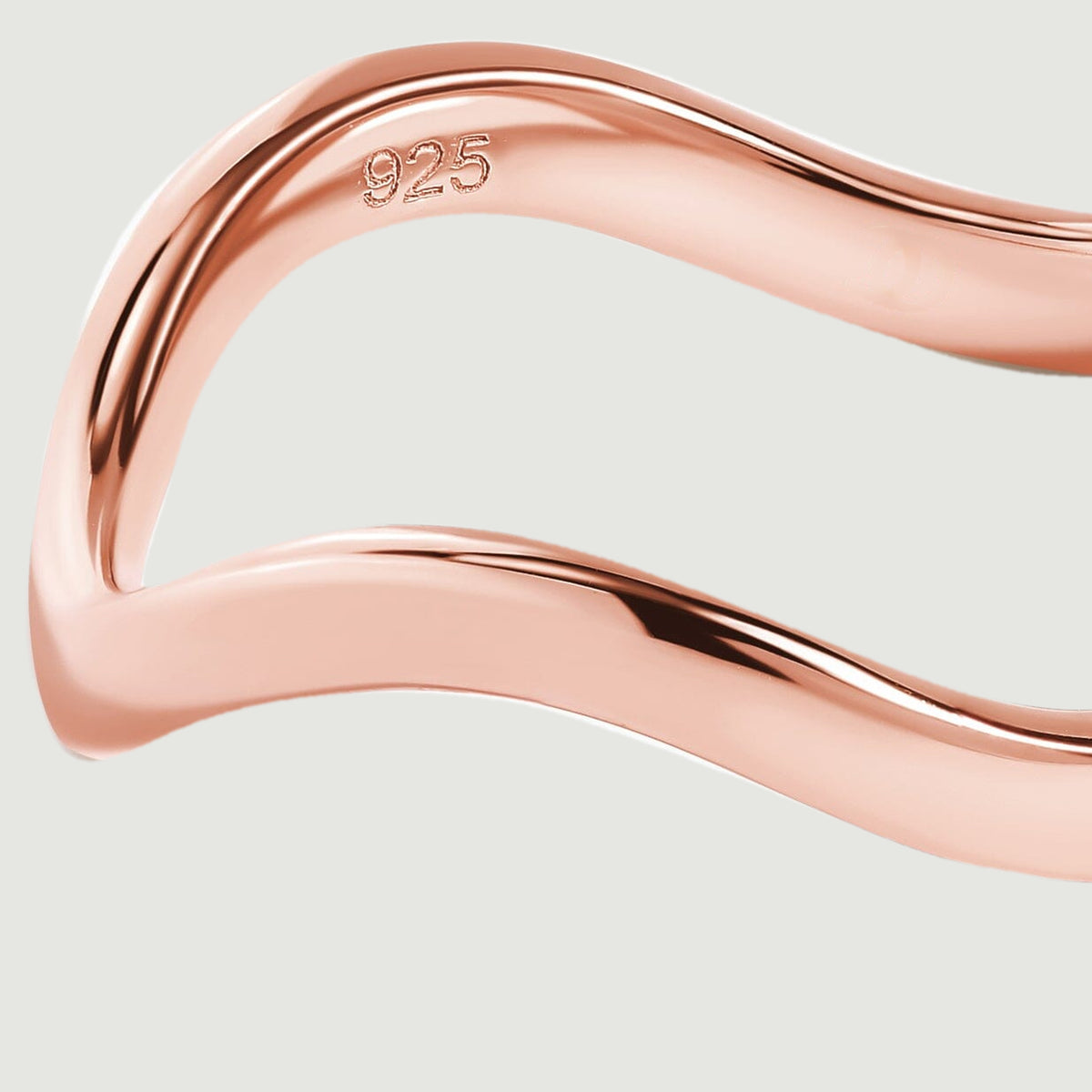 A close view reveals the rose gold ring edge and the 925 stamp inside the band.