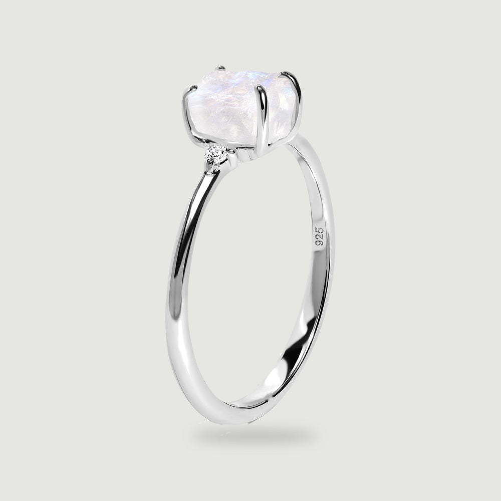 The upright silver ring reveals the raised moonstone setting, slim band and inner 925 stamp.