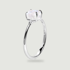 The upright silver ring reveals the raised moonstone setting, slim band and inner 925 stamp.