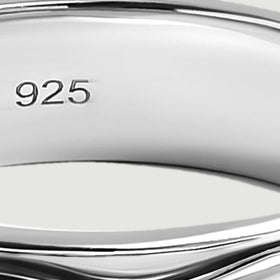 The 925 stamp is visible on the smooth inner wall of the silver ring.