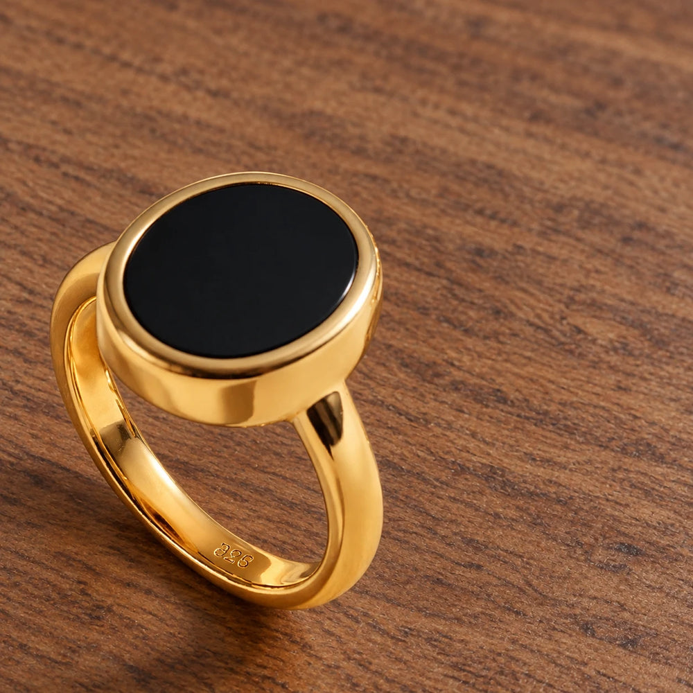 Stillpoint black onyx oval ring in yellow gold vermeil, side view of the bezel and closed band.