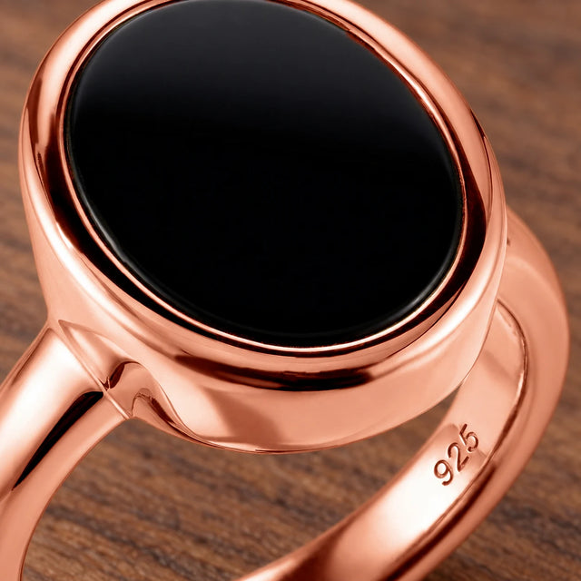 Stillpoint black onyx oval ring in rose gold vermeil, close-up of the bezel and band hallmark.