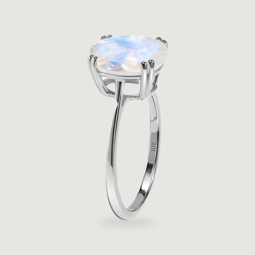 The white gold ring is shown from the side with its open basket and slender band visible.