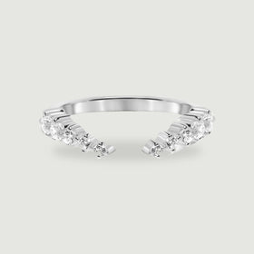 A polished sterling silver open ring displays two curved rows of round clear stones on a light gray background.