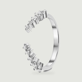 An upright silver ring shows the smooth rear band and raised settings around its open front.